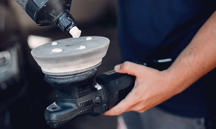 applying polish to a caravan by machine